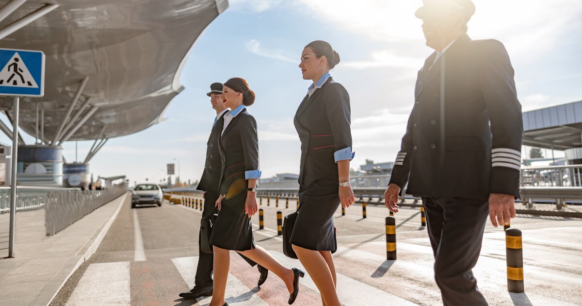 flight attendants and pilots walking at the airport flight attendants and pilots walking at the airport